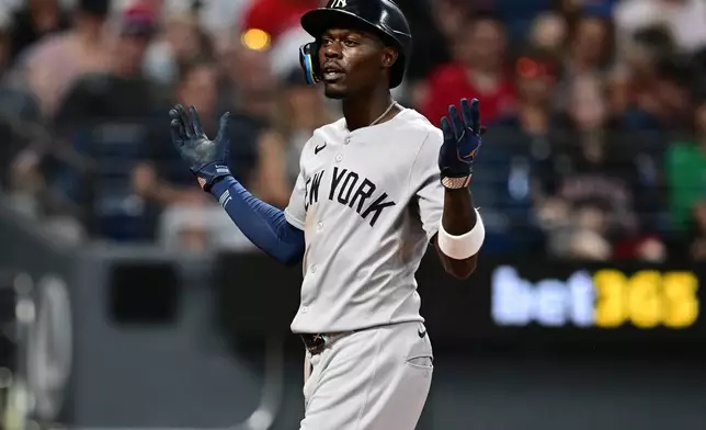 New York Yankees' Jazz Chisholm Jr. celebrates after hitting a solo home run off Cleveland Guardians relief pitcher Tim Herrin during the eighth inning of a baseball game, Tuesday, June 9, 2026, in Cleveland. (AP Photo/David Dermer)