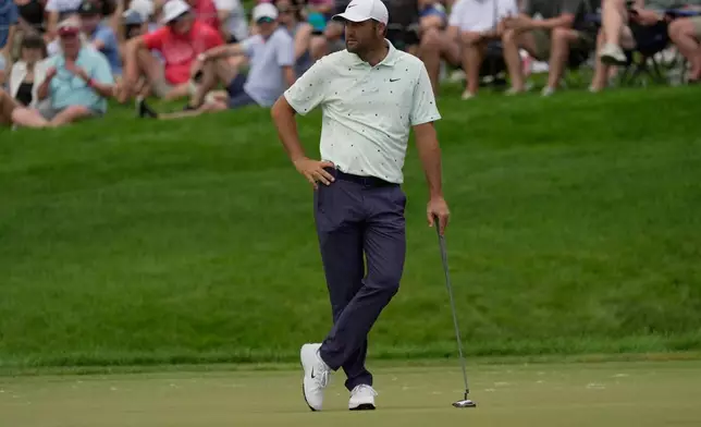 Scottie Scheffler pauses on the 14th green during the second round of the Memorial golf tournament in Dublin, Ohio, Friday, June 5, 2026. (AP Photo/Sue Ogrocki)