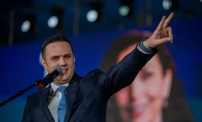 Lumir Abdixhiku, opposition leader, flashes victory sign at the closing political rally of the Democratic League of Kosovo (LDK), in capital Pristina on Friday, June 5, 2026. (AP Photo/Visar Kryeziu)
