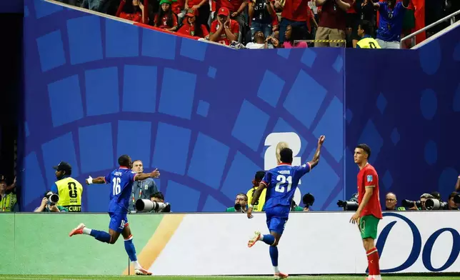 Haiti's Lenny Joseph (16) celebrates after Morocco goalkeeper Yassine Bounou scored an own goal during the World Cup Group C soccer match between Morocco and Haiti in Atlanta, Wednesday, June 24, 2026. (AP Photo/Erik S. Lesser)