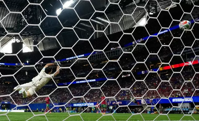 Morocco goalkeeper Yassine Bounou (1) is unable to stop a shot for goal by Haiti's Wilson Isidor (18) during the World Cup Group C soccer match between Morocco and Haiti in Atlanta, Wednesday, June 24, 2026. (AP Photo/Mike Stewart)
