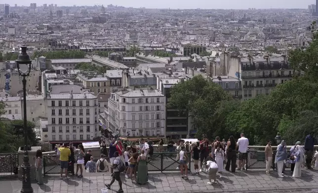 A view of roofs of Paris, Tuesday, June 23, 2026. (AP Photo/John Leicester)