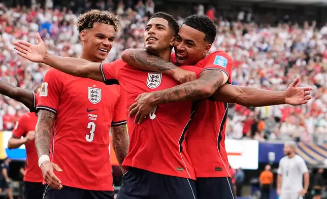 England's Jude Bellingham (10) celebrates with teammates after scoring their first goal during the World Cup Group L soccer match between Panama and England in East Rutherford, N.J., near New York, Saturday, June 27, 2026. (AP Photo/Steve Luciano)