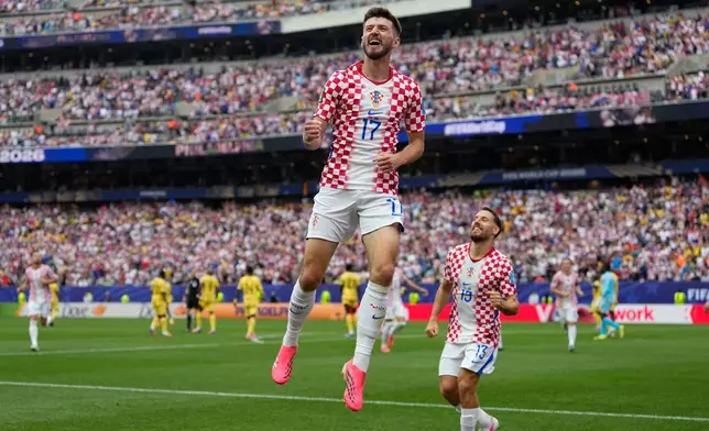 Croatia's Petar Sucic (17) celebrates after scoring his side's opening goalbduring the World Cup Group L soccer match between Croatia and Ghana in Philadelphia, Saturday, June 27, 2026. (AP Photo/Matt Slocum)