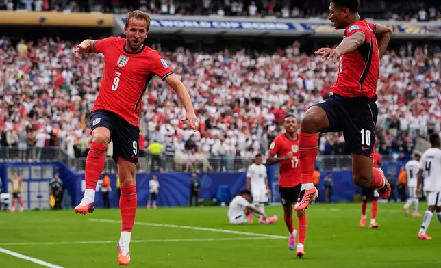 England's Harry Kane (9) celebrates with England's Jude Bellingham (10) during the World Cup Group L soccer match between Panama and England in East Rutherford, N.J., near New York, Saturday, June 27, 2026. (AP Photo/Steve Luciano)