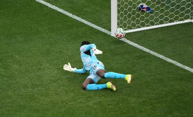 Ghana goalkeeper Benjamin Asare (16) lets the ball slip past for an opening goal by Croatia's Petar Sucic (17) during the World Cup Group L soccer match between Croatia and Ghana in Philadelphia, Saturday, June 27, 2026. (AP Photo/Matt Rourke)