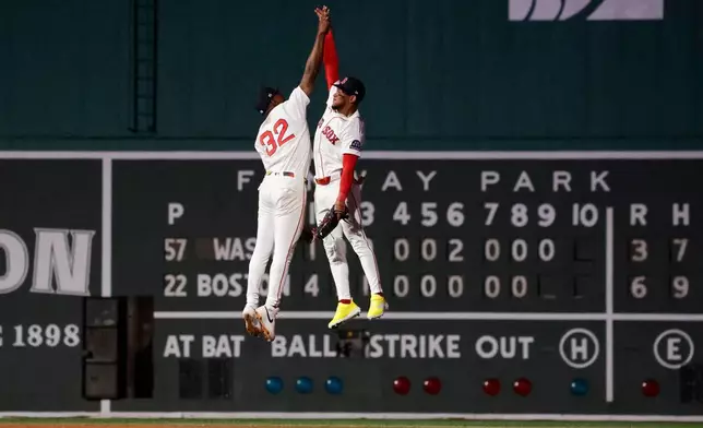 Boston Red Sox's Andruw Monasterio (32) celebrates with teammate Ceddanne Rafaela after defeating the Washington Nationals in a baseball game, Monday, June 29, 2026, in Boston. (AP Photo/Mary Schwalm)