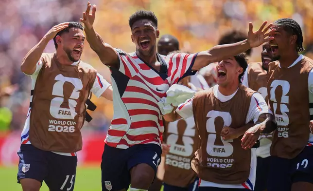 United States' Alex Freeman (16), second left, celebrates after scoring his side's second goal during the World Cup Group D soccer match between the United States and Australia in Seattle, Friday, June 19, 2026. (AP Photo/Manu Fernandez)