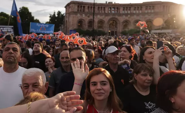 Supporters of Armenia's ruling Civil Contract party led by Prime Minister Nikol Pashinyan gather in Republic Square in Yerevan, Armenia, Friday, June 5, 2026, for the party's final campaign rally ahead of the upcoming parliamentary elections. (AP Photo/Anthony Pizzoferrato)