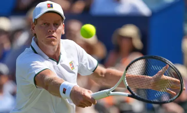 Jannik Sinner of Italy returns during a tennis exhibition match against Cameron Norrie of Great Britain at the Hurlingham Tennis Club in London, Wednesday, June 24, 2026.(AP Photo/Kirsty Wigglesworth)