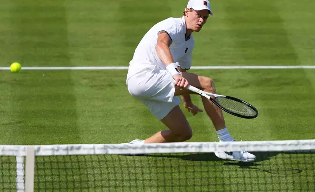 Jannik Sinner of Italy returns during a tennis exhibition match against Cameron Norrie of Great Britain at the Hurlingham Tennis Club in London, Wednesday, June 24, 2026.(AP Photo/Kirsty Wigglesworth)
