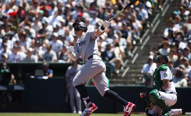New York Yankees' Aaron Judge hits an RBI single during the third inning of a baseball game against the Athletics, Sunday, May 31, 2026, in West Sacramento, Calif. (AP Photo/Scott Marshall)