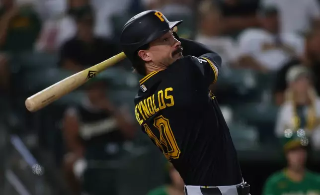 Pittsburgh Pirates' Bryan Reynolds hits a two run during the seventh inning of a baseball game against the Athletics Tuesday, June 16, 2026, in West Sacramento, Calif. (AP Photo/Scott Marshall)