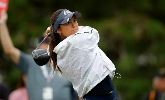 Yana Wilson watches her tee shot on the 10th hole during the final round of the Dow Championship LPGA golf tournament, Sunday, June 14, 2026, at Midland Country Club in Midland, Mich. (AP Photo/Al Goldis)