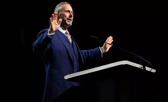 Clint Pressley, president of the Southern Baptist Convention, addresses attendees during the annual meeting, Tuesday, June 9, 2026, in Orlando, Fla. (AP Photo/Phelan M. Ebenhack)