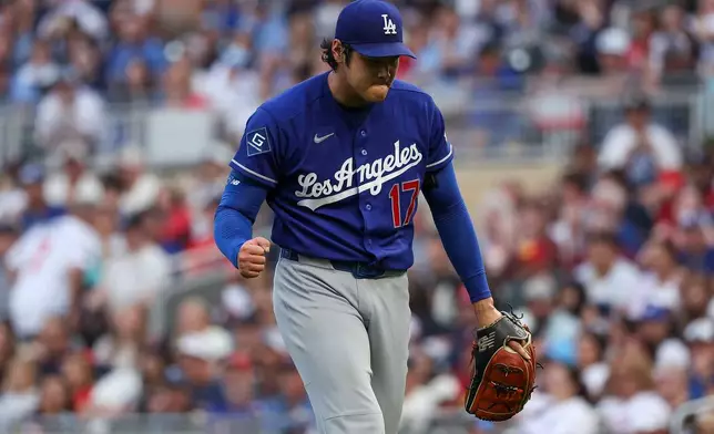Los Angeles Dodgers starting pitcher Shohei Ohtani reacts during the sixth inning of a baseball game against the Minnesota Twins, Wednesday, June 24, 2026, in Minneapolis. (AP Photo/Matt Krohn)