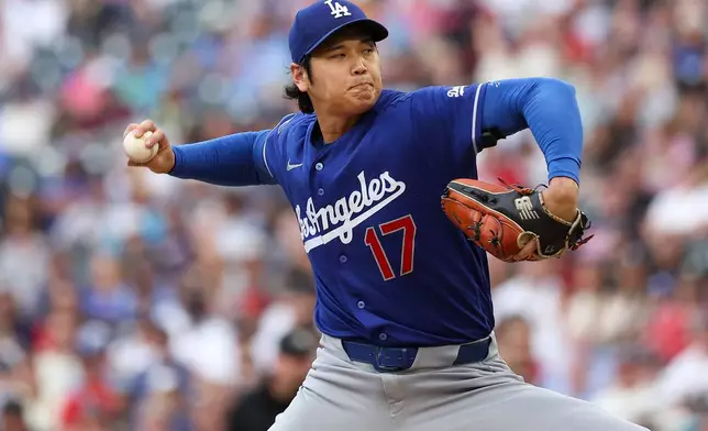Los Angeles Dodgers starting pitcher Shohei Ohtani delivers against the Minnesota Twins during the first inning of a baseball game, Wednesday, June 24, 2026, in Minneapolis. (AP Photo/Matt Krohn)