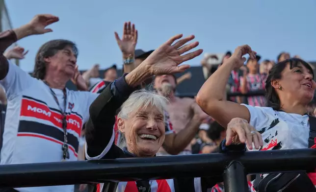 Chacarita Juniors fans cheer during an Argentine league against Gimnasia y Tiro in Buenos Aires, Argentina, Sunday, April 12, 2026. (AP Photo/Rodrigo Abd)