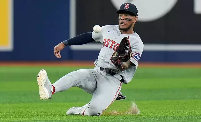 Boston Red Sox center fielder Ceddanne Rafaela makes a sliding catch on a pop out by Tampa Bay Rays' Ryan Vilade during the fifth inning of a baseball game Monday, June 8, 2026, in St. Petersburg, Fla. (AP Photo/Chris O'Meara)