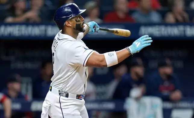 Tampa Bay Rays' Yandy Díaz watches his run scoring sacrifice fly off Boston Red Sox's Alec Gamboa during the eighth inning of a baseball game Monday, June 8, 2026, in St. Petersburg, Fla. (AP Photo/Chris O'Meara)