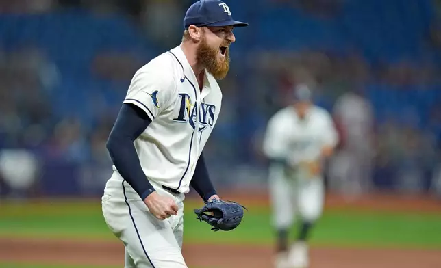 Tampa Bay Rays pitcher Bryan Baker reacts after closing out the Boston Red Sox during the ninth inning of a baseball game Monday, June 8, 2026, in St. Petersburg, Fla. (AP Photo/Chris O'Meara)