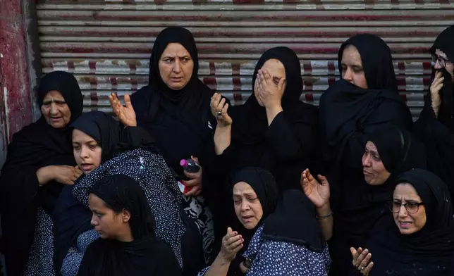 Kashmiri Shiite Muslim women mourn as they participate in a Muharram procession in Srinagar, Indian controlled Kashmir, Wednesday, June 24, 2026. (AP Photo/Dar Yasin)