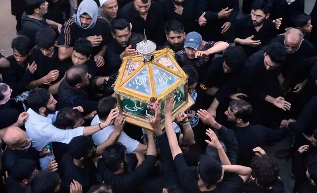 Kashmiri Shiite Muslims participate in a Muharram procession in Srinagar, Indian controlled Kashmir, Tuesday, June 23, 2026. (AP Photo/Mukhtar Khan)