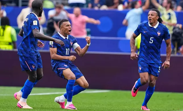 France's Kylian Mbappe (10) celebrates after scoring his team's first goal during the World Cup Group I soccer match between France and Iraq in Philadelphia, Monday, June 22, 2026. (AP Photo/Petr David Josek)