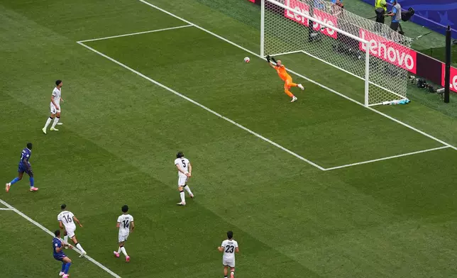 France's Kylian Mbappe scores his side's opening goal against Iraq during the World Cup Group I soccer match in Philadelphia, Monday, June 22, 2026. (AP Photo/Matt Rourke)
