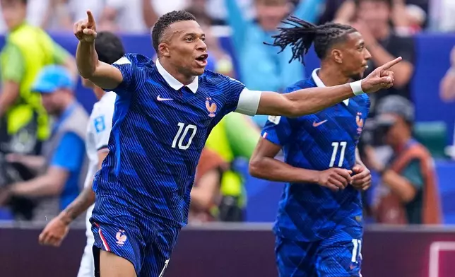 France's Kylian Mbappe (10) celebrates after scoring his team's first goal during the World Cup Group I soccer match between France and Iraq in Philadelphia, Monday, June 22, 2026. (AP Photo/Petr David Josek)