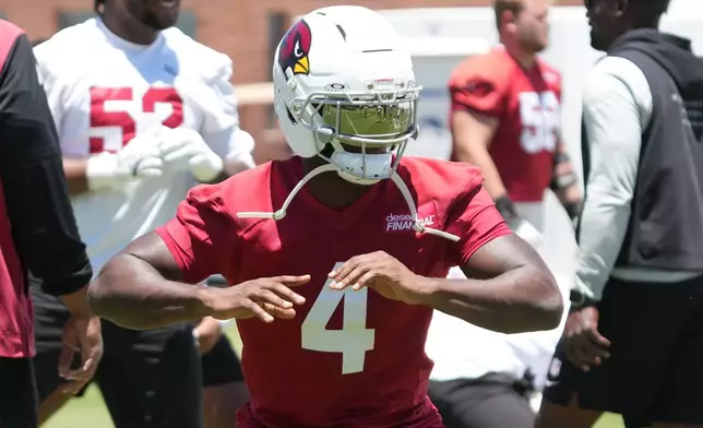Arizona Cardinals running back Jeremiyah Love (4) works out during the NFL football team's practice, Tuesday, June 9, 2026, in Tempe, Ariz. (AP Photo/Rick Scuteri)