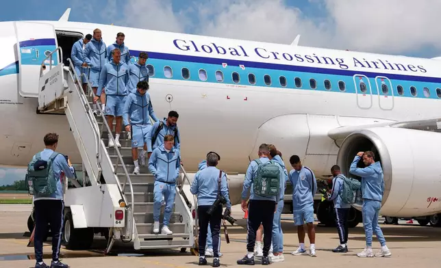 England's national team arrive for the World Cup soccer tournament in Kansas City, Mo., Saturday, June 13, 2026. (AP Photo/Charlie Riedel)