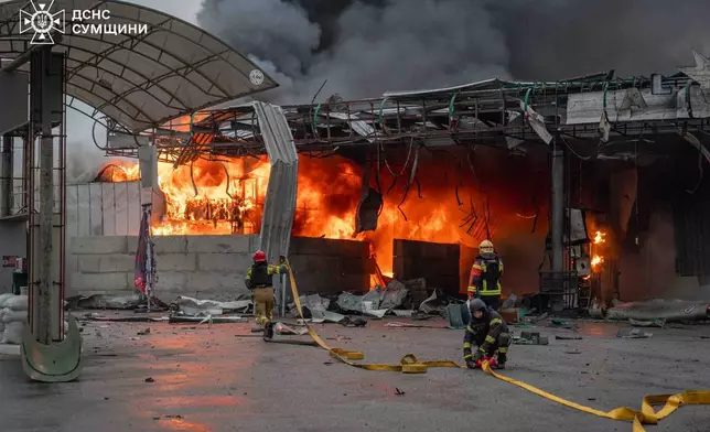 In this photo provided by the Ukrainian Emergency Service, firefighters put out a fire in a gas station following a Russian air attack in Sumy, Ukraine, Thursday, June 25, 2026. (Ukrainian Emergency Service via AP)