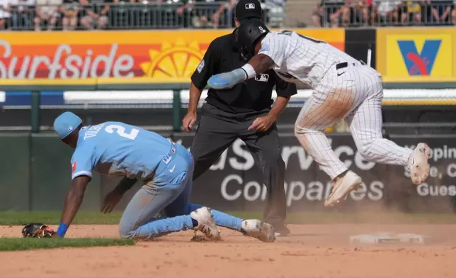 Chicago White Sox' Luisangel Acuña (0) is safe at second base as Kansas City Royals second baseman Tyler Tolbert (2) can't handle an errant throw during the seventh inning of a baseball gam,e Saturday, June 27, 2026, in Chicago. (AP Photo/David Banks)
