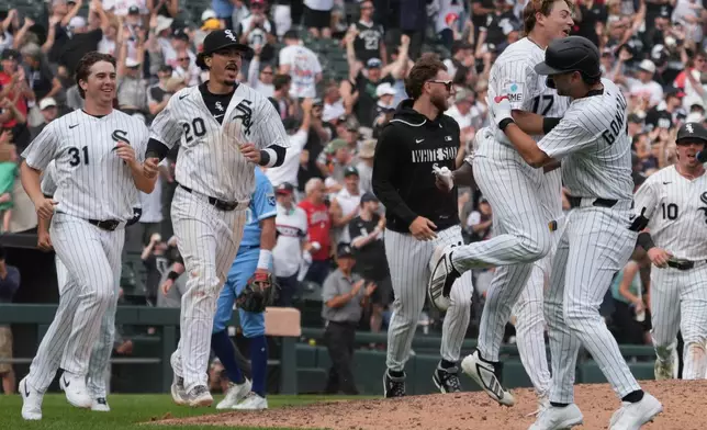 Chicago White Sox's Jacob Gonzalez, right, celebrates his walk off single against the Kansas City Royals during the ninth inning of a baseball game Saturday, June 27, 2026, in Chicago. (AP Photo/David Banks)