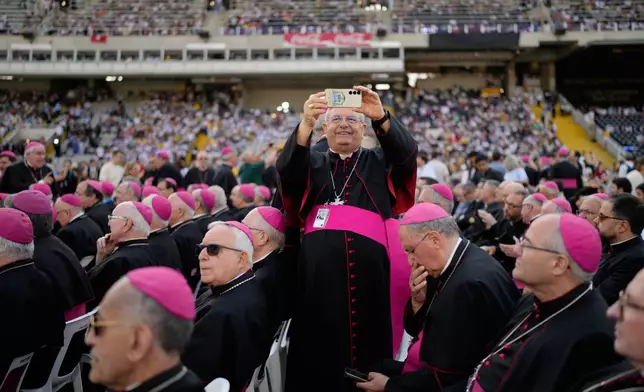 Bishops wait the arrival of Pope Leo XIV to attend a prayer vigil at Lluis Companys Olympic Stadium in Barcelona, Spain, Tuesday, June 9, 2026. (AP Photo/Bernat Armangue)