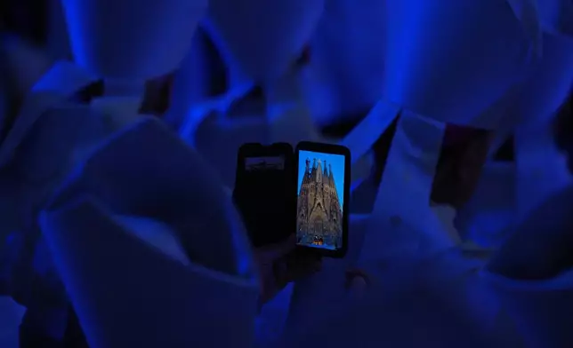 Priests attend the inauguration of the Tower of Jesus Christ at the Basilica of the Sagrada FamÌlia in Barcelona, Spain, Wednesday, June 10, 2026. (AP Photo/Emilio Morenatti)