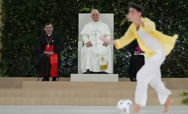 Youths stage a soccer match during a meeting with Pope Leo XIV and the diocesan community at the Santiago Bernabeu stadium in Madrid, Spain, Monday, June 8, 2026 (AP Photo/Alessandra Tarantino)