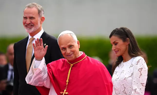 Pope Leo XIV next to King Felipe and Queen Letizia arrives at Adolfo Suarez-Madrid Barajas Airport in Madrid, Spain, Saturday, June 6, 2026, at the start of a seven-day pastoral visit to mainland Spain and the Canary Islands. (AP Photo/Manu Fernandez)