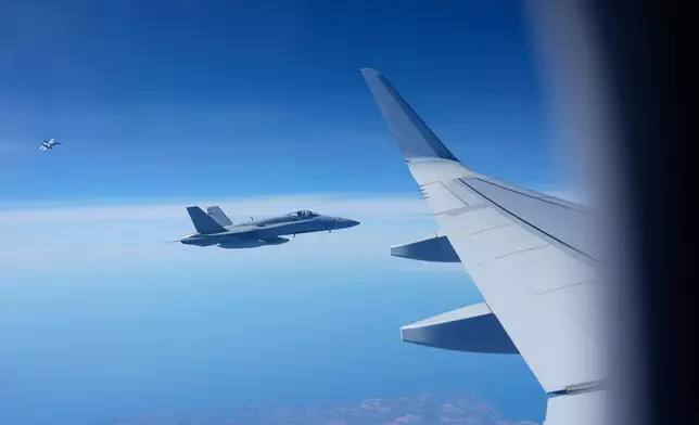 Spain's Airforce fighter jets escort the papal flight departed from Rome heading to Madrid, Saturday, June 6, 2026, on the occasion of Pope Leo XIV apostolic journey to Spain. (AP Photo/Alessandra Tarantino, Pool)