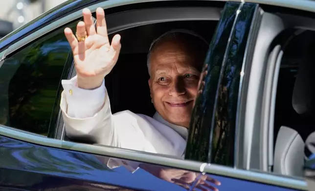 Pope Leo XIV waves in Madrid, Spain, Monday, June 8, 2026. (AP Photo/Andrea Comas)