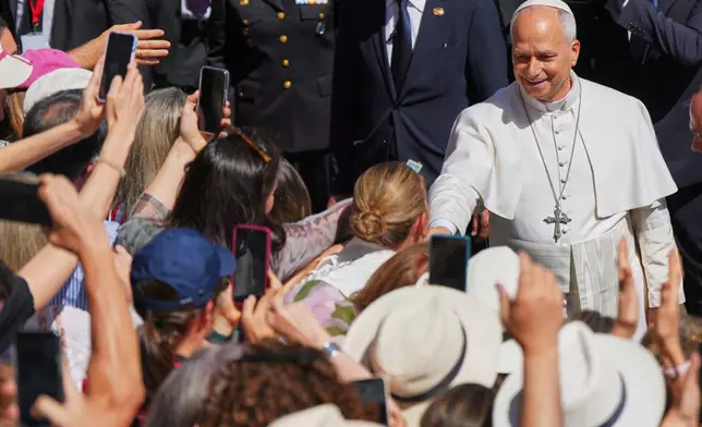 Pope Leo XIV shakes hands outside the Spanish parliament in Madrid, Spain, Monday, June 8, 2026. (AP Photo/Manu Fernandez)
