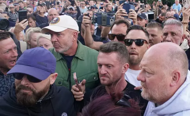 Tommy Robinson attends a protest outside the police station in Southampton, England, on Tuesday, June 2, 2026, concerning December 2025 stabbing victim Henry Nowak, 18. (Gareth Fuller/PA via AP)