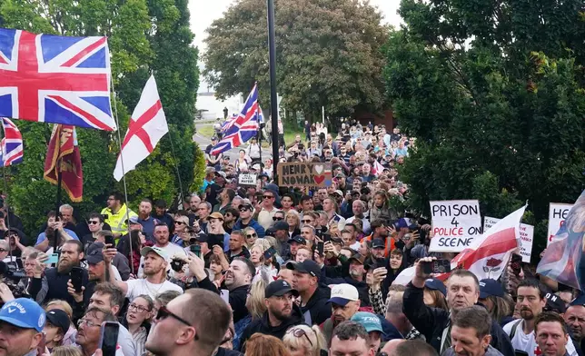 People gather to protest outside Southampton police station, Southampton, England, Tuesday June 2, 2026, after the fatal stabbing of Henry Nowak, a British teenager who was handcuffed despite claiming he was the crime victim. (Gareth Fuller/PA via AP)