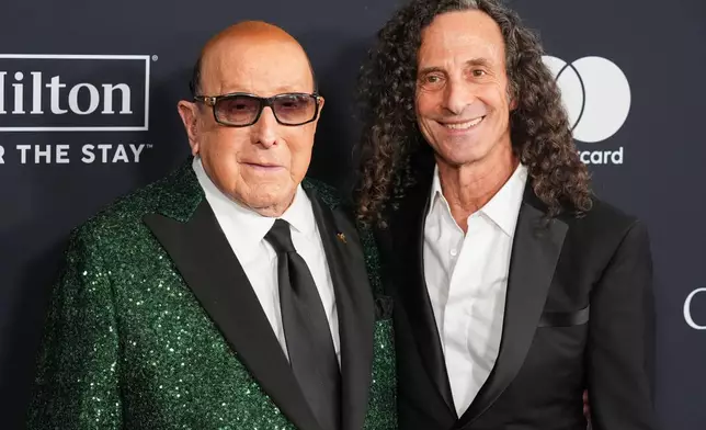 FILE - Clive Davis, left, and Kenny G arrive at the Pre-Grammy Gala in Beverly Hills, Calif., on Jan. 31, 2026. (AP Photo/Chris Pizzello, File)