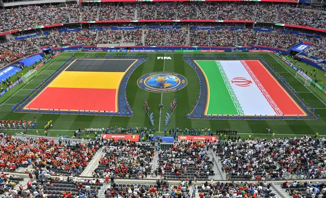 Belgian and Iranian flags are seen on the pitch before the World Cup Group G soccer match between Belgium and Iran in Inglewood, Calif., near Los Angeles, Sunday, June 21, 2026. (AP Photo/Jayne Kamin-Oncea)