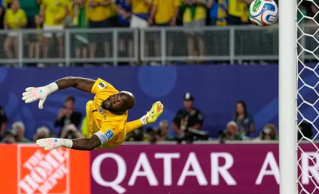 Haiti goalkeeper Johny Placide reaches for the ball during the World Cup Group C soccer match between Brazil and Haiti in Philadelphia, Friday, June 19, 2026. (AP Photo/Matt Slocum)
