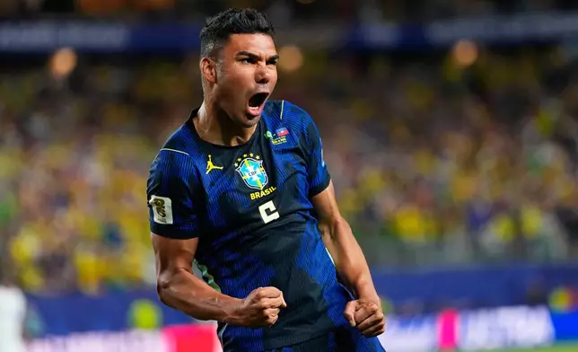 Brazil's Casemiro (5) celebrates his side's second goal by Matheus Cunha (9) during the World Cup Group C soccer match between Brazil and Haiti in Philadelphia, Friday, June 19, 2026. (AP Photo/Petr David Josek)