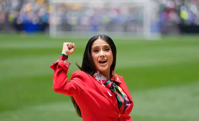Mexican-American actress Salma Hayek gestures on the pitch before the start of the World Cup Group A soccer match between Mexico and South Africa in Mexico City, Thursday, June 11, 2026. (AP Photo/Natacha Pisarenko)