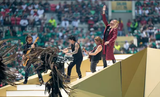 Mexican pop rock band Mana perform before the start of the World Cup Group A soccer match between Mexico and South Africa in Mexico City, Thursday, June 11, 2026. (AP Photo/Natacha Pisarenko)